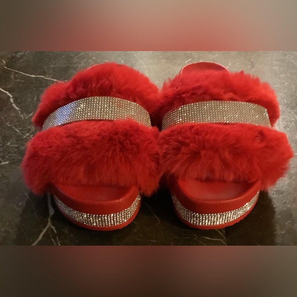 Women’s red puffy ID required sandals